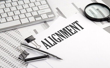 ALIGNMENT text on paper with chart and keyboard, business concept