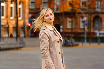 beautiful young woman in the city in autumn