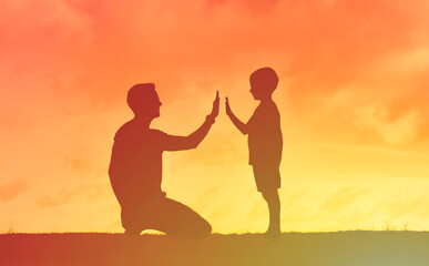 parent and child giving high five 