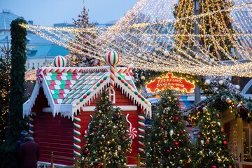 Christmas tree and big giant gingerbread house stall.
