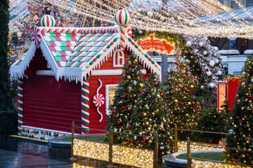 Christmas tree and big giant gingerbread house stall.