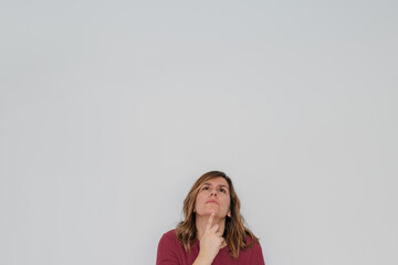 pensive woman looking up from the image