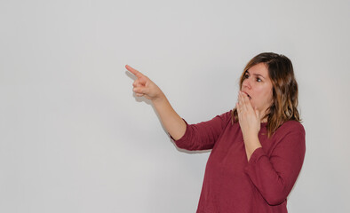 woman pointing on a white background