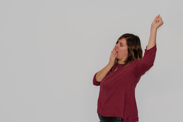 woman yawning on a white background