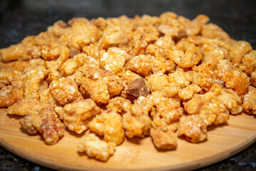 Crispy and fresh pork rinds in selective focus