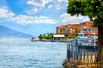 Bellagio, Lake Como, Italy. Romantic scenery panorama of coast and lakefront with tree, famous town, popular luxury resort. Summer landscape view