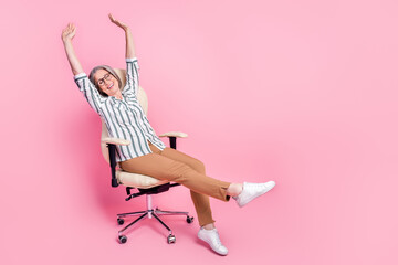 Photo of cheerful tired lady wear smart casual clothes stretching sitting office leather chair empty space isolated pink color background