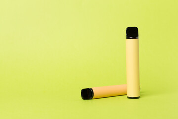 Disposable electronic cigarettes on color background