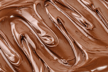 Chocolate cream, sauce, paste, syrup. Background of  Liquid chocolate. Curl. Texture, Close up, top view.