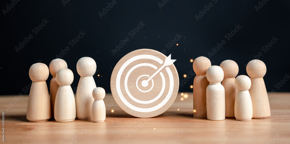 Aufkleber target and goal concept, wooden figures standing around dartboard and arrow for creative and set up 