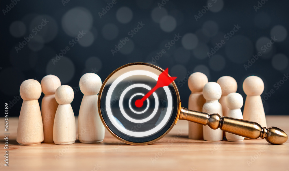 Aufkleber target and goal concept, Wooden figures standing around dartboard and arrow for creative and set up business objective target goal, marketing solution, target for business investment.