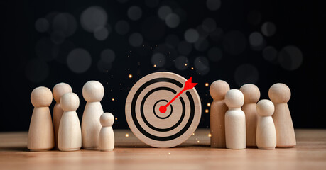 target and goal concept, Wooden figures standing around dartboard and arrow for creative and set up...