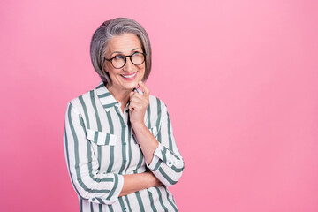 Photo of charming dreamy lady wear smart casual clothes smiling looking empty space isolated pink color background