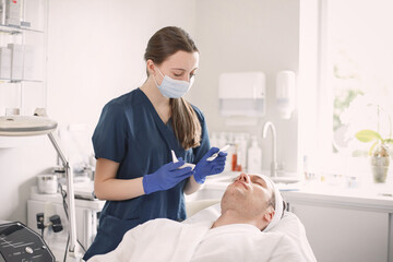 Man in cosmetologist cabinet has a skincare procedure