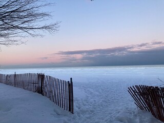 Pink sunset winter wonderland frozen Lake Michigan, North Shore, IL