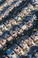 Vertical aerial view of suburban homes in the Santa Clarita neighborhood of Los Angeles County, California. © trekandphoto