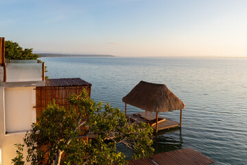 Sunrise from the terrace of the hotel at the lagoon in Bacalar. © Apolinar