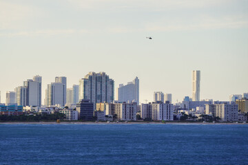 Fototapeta premium Beautiful aerial panoramic view of the city of Miami, its buildings, marina, yachts and luxurious suburbs houses