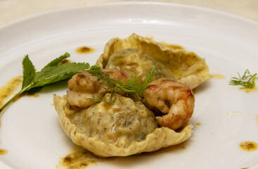 Ravioloni with prawns, mint, basil and fennel.