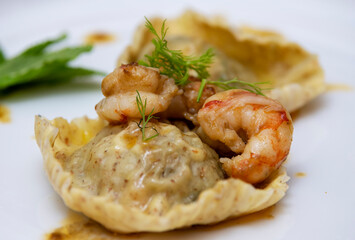 Ravioloni with prawns, mint, basil and fennel.