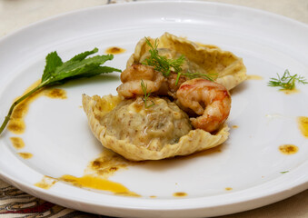 Ravioloni with prawns, mint, basil and fennel.