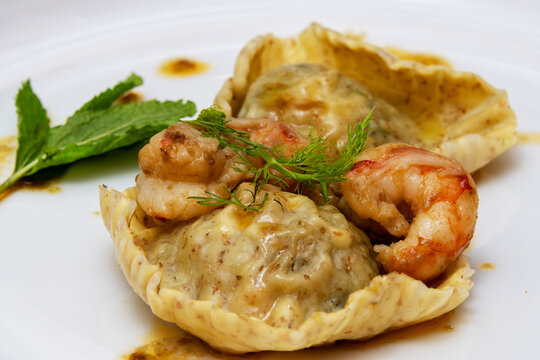 Ravioloni with prawns, mint, basil and fennel.