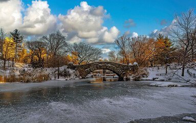 Gapstow Bridge in Central Park after snow storm in winter, early morning