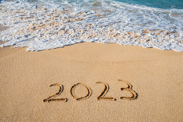 2023 written in the sand- New Year concept