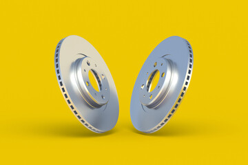 Brake disks on yellow background. Spare parts for car service. Automotive components. 3d render