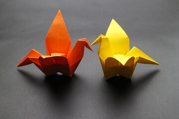 Simple crane paper origami with black background. japanese style origami background 