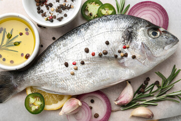 Fresh dorado fish and spices on white table, flat lay