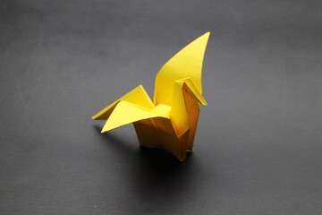 Simple crane paper origami with black background. japanese style origami background 