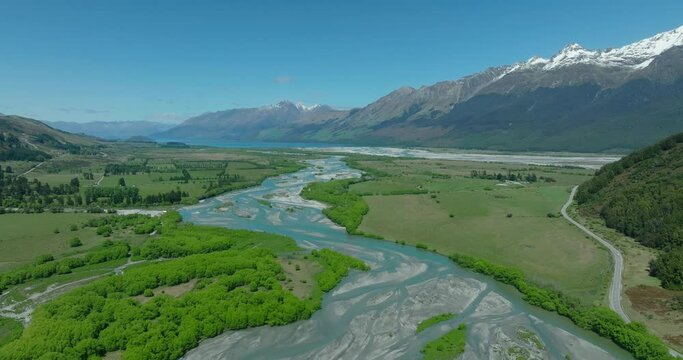 Rees River meandering through bottomlands in mountain range, New Zealand