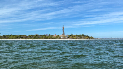 lighthouse on the shore of the ocean