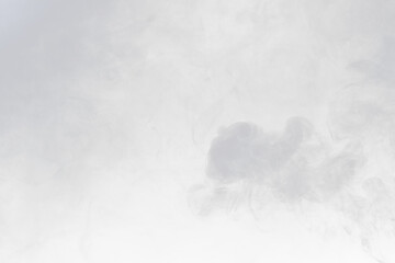 Dense Fluffy Puffs of White Smoke and Fog on black Background, Abstract Smoke Clouds, Movement...