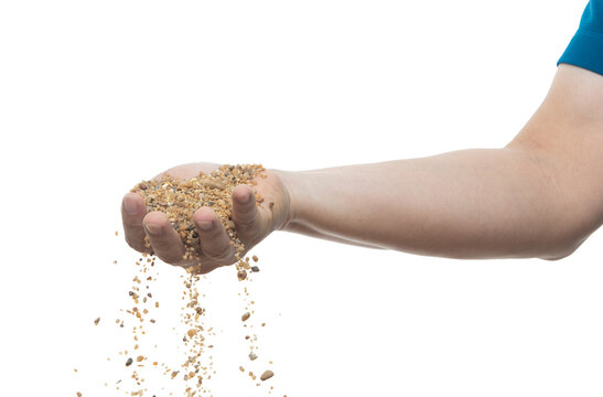 Man Hand Hold Pour Sands Of Time.Big Size Sand Flying Explosion, Golden Grain Wave Explode. Abstract Cloud Fly. Yellow Colored Sand Splash Throwing In Air. White Background Isolated.