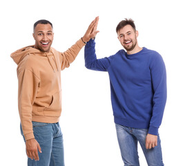 Men giving high five on white background