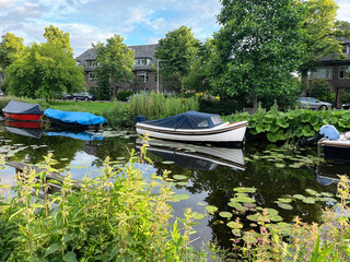 Beautiful view of moored boats in canal on sunny day