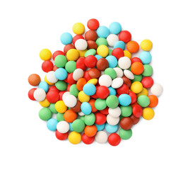 Many small colorful candies on white background, top view