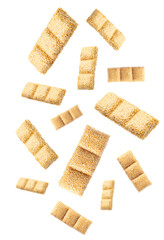 Delicious sesame kozinaki bars falling on white background