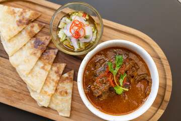 Beef Curry and Roti. beef, Thai food, placed on the table in the restaurant.