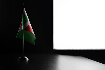 Small national flag of the Burundi on a black background