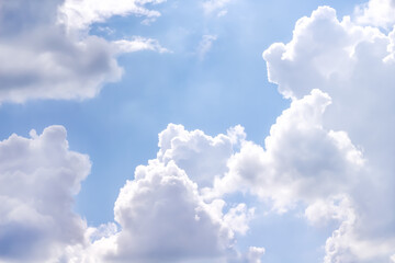 Cloudy on bright blue sky background close up