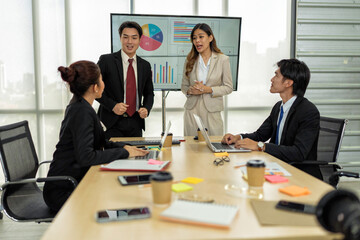 Employee meeting big screen tv presentation conference discussion brainstorming and working together