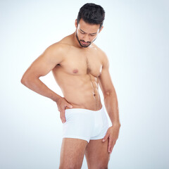 Fitness, underwear or man in studio for training, body exercise or bodybuilding workout for wellness. White background, motivation or healthy male model body builder with muscle development or goals