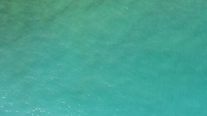 texture of clear emerald sea water, top view