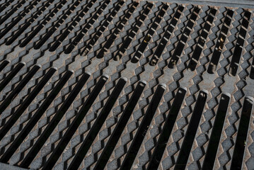 Obraz premium metal drain hatch in asphalt