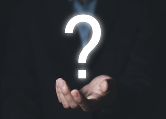 businessman hand showing a question mark icon	
