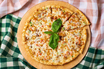 taco pizza, on a checkered fabric background