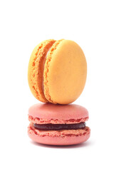 French popular dessert meringue or almond cookie with filling cream or jam macaroons yellow and pink closed up isolated on white